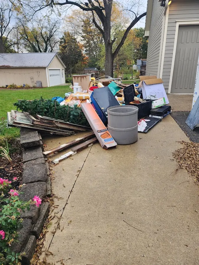 Dumpster being loaded with debris for Roofing Dumpster Rental in Vassalboro
